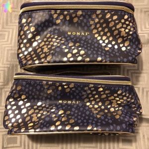 2 Monet gold and navy blue cosmetic bags